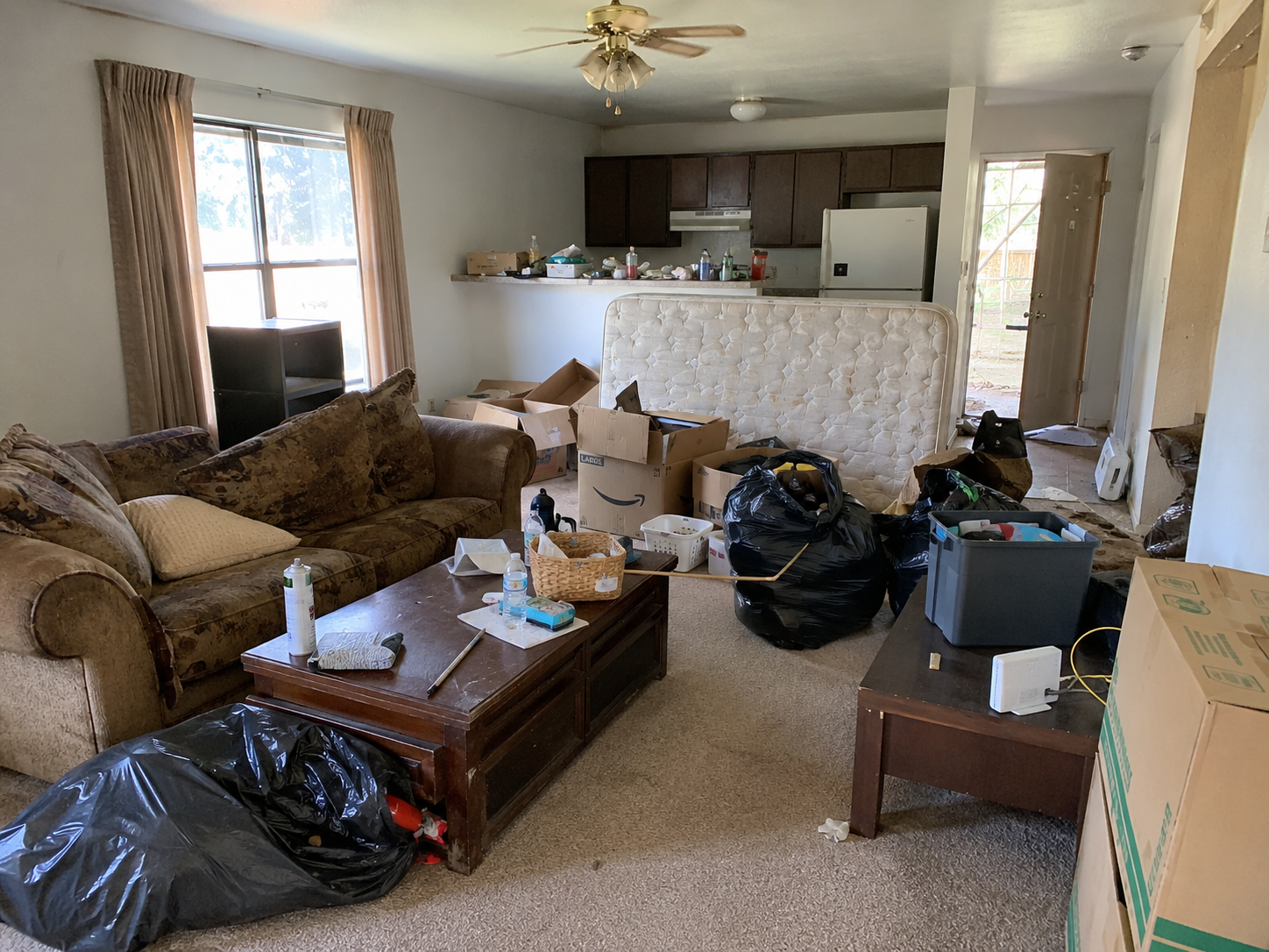 Cluttered apartment before cleanout service in Oroville