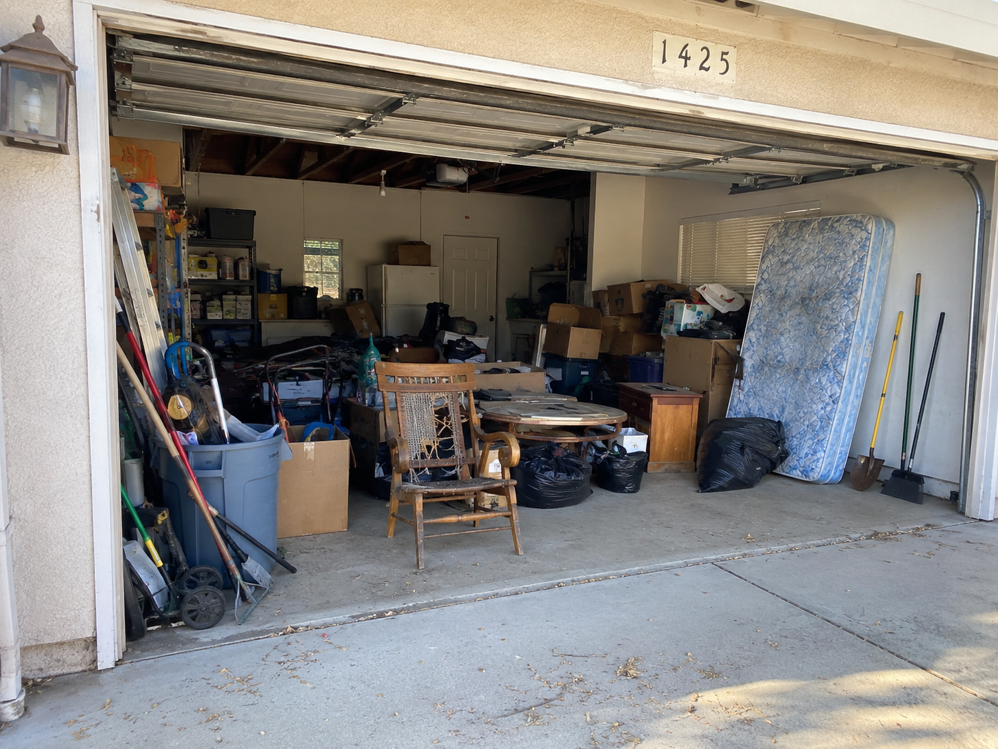 Cluttered garage before junk removal cleanout in Oroville